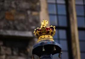 A crown placed on a podium