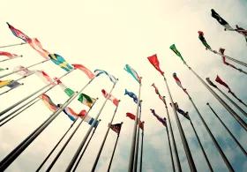 Looking up at flags of the world from below