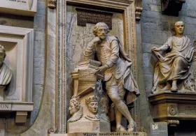 Old statue of man leaning on hand