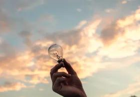 Holding a lightbulb up to the sky