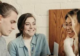 Group of learners smiling and interacting