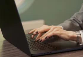 Woman typing on laptop