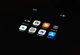 An ipad in a dark room showing application such as app store, chat gpt, settings