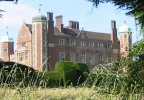 Photo of Madingley hall and its gardens. 