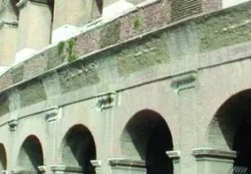 A close-up view of the exterior of the Colosseum in Rome, Italy.