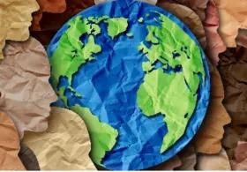 Origami globe with surrounding paper silhouettes of human faces, arranged in a circle.