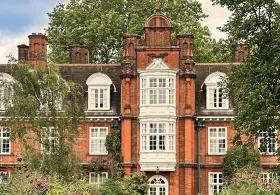 Newnham College façade on a sunny day.