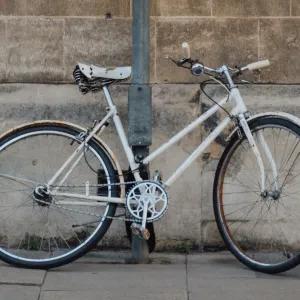 Bike leaning against wall in Cambridge