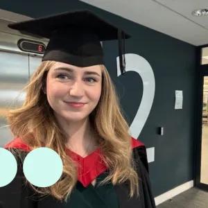 Blonde woman in graduation outfit 