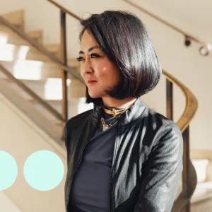 Image of woman with short black hair from side profile 