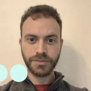 Selfie of a man with dark hair and facial hair 