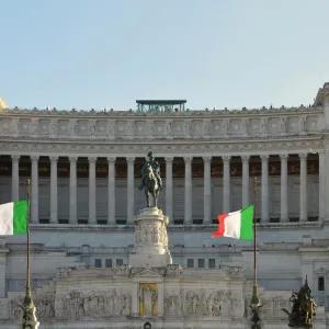 Italian government building with Italian flags displayed outside its entrance