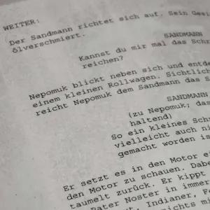 A close up of pages of script.