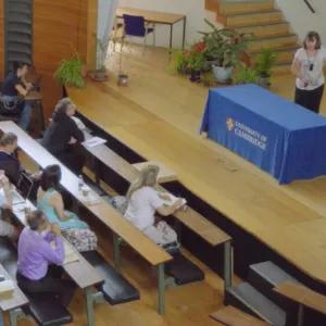 People in lecture theatre listening to a talk