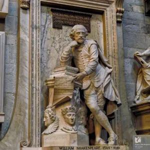 Old statue of man leaning on hand