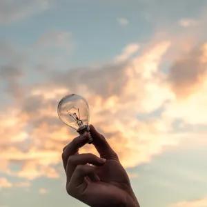 Holding a lightbulb up to the sky