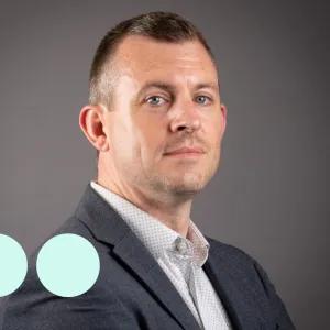 Headshot of man, looking directly at camera