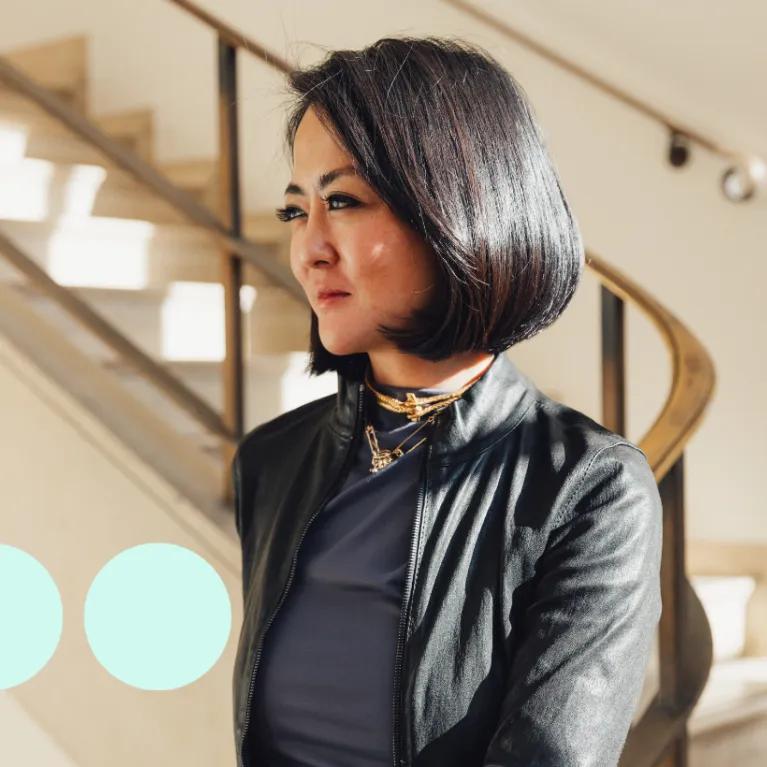 Image of woman with short black hair from side profile 