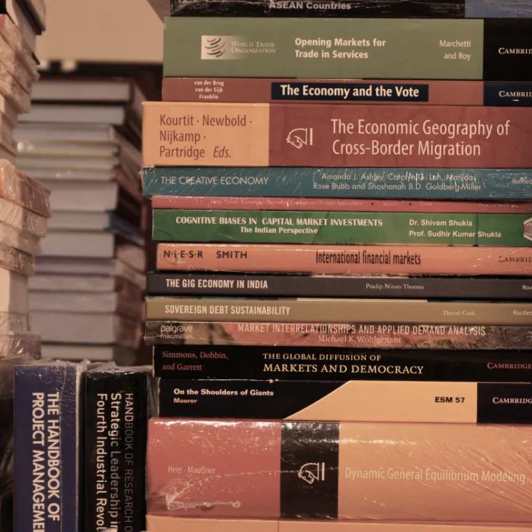 Multiple stacks of non-fiction books