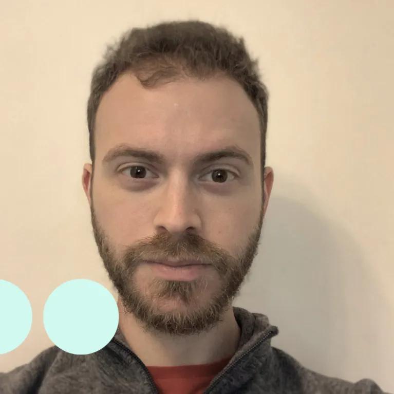 Selfie of a man with dark hair and facial hair 