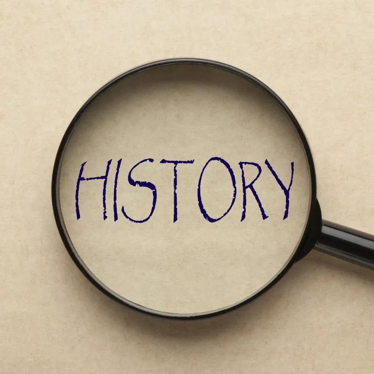 magnifying glass with the word 'History' written in the middle
