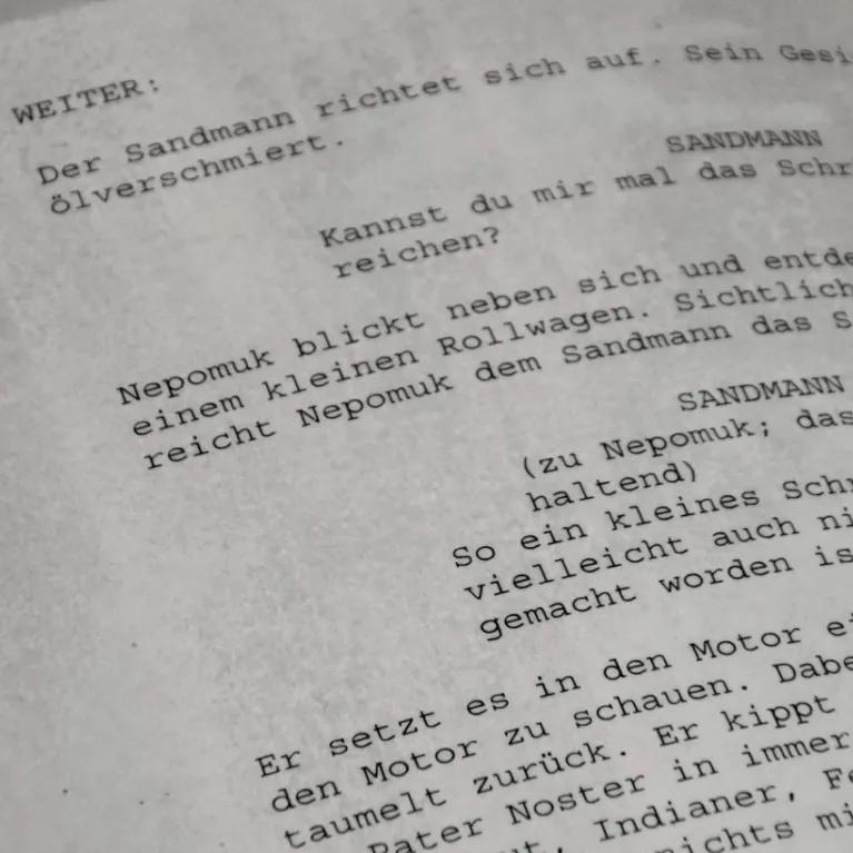 A close up of pages of script.