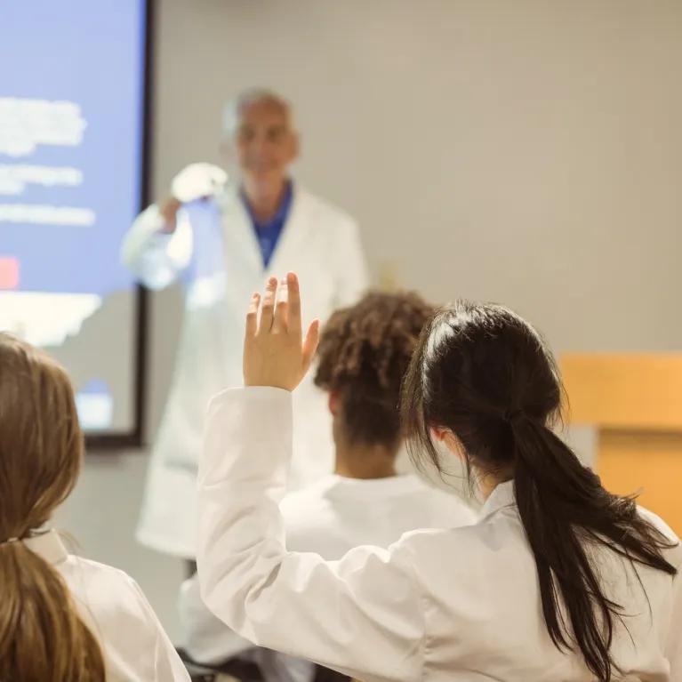 Clinician presenting to students