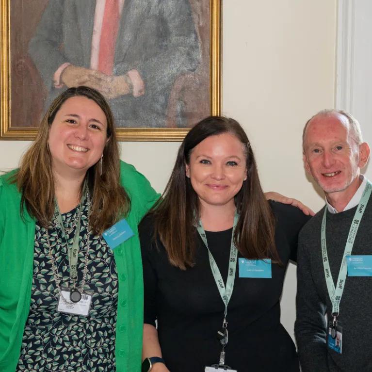 Professional services team smiling at camera