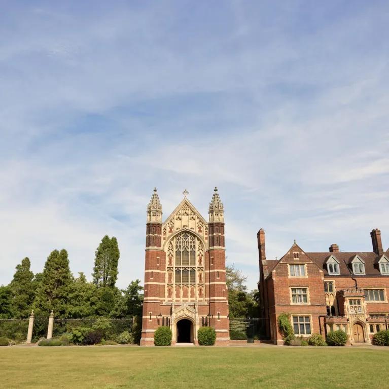 The exterior of Selwyn College against a blue sky.