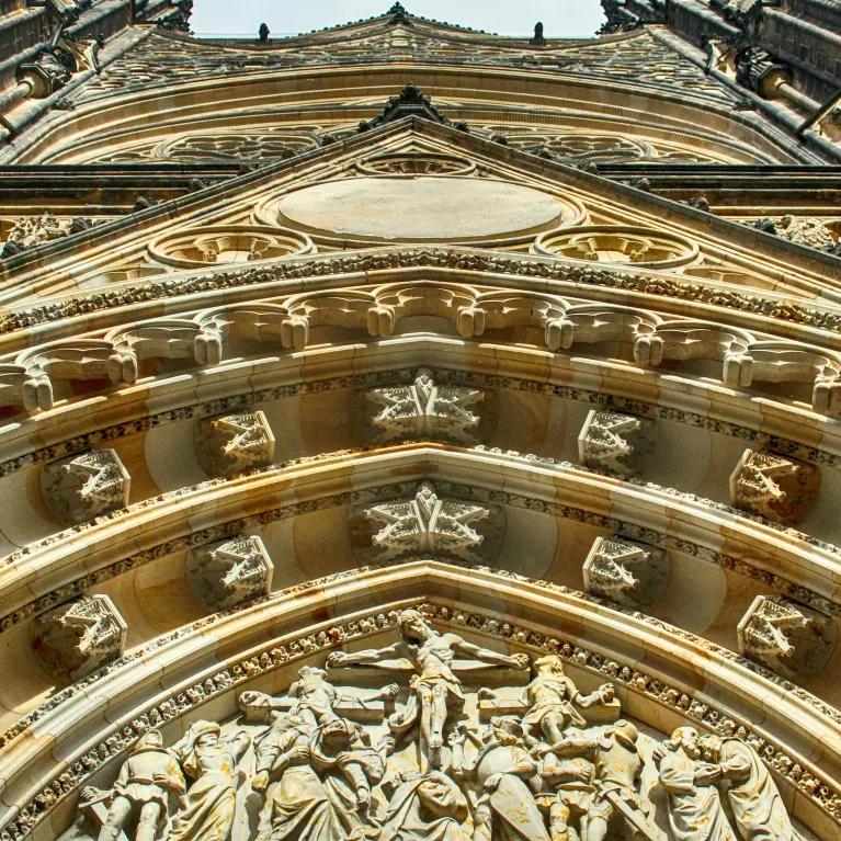 A low-angle view of a gold-toned architectural building