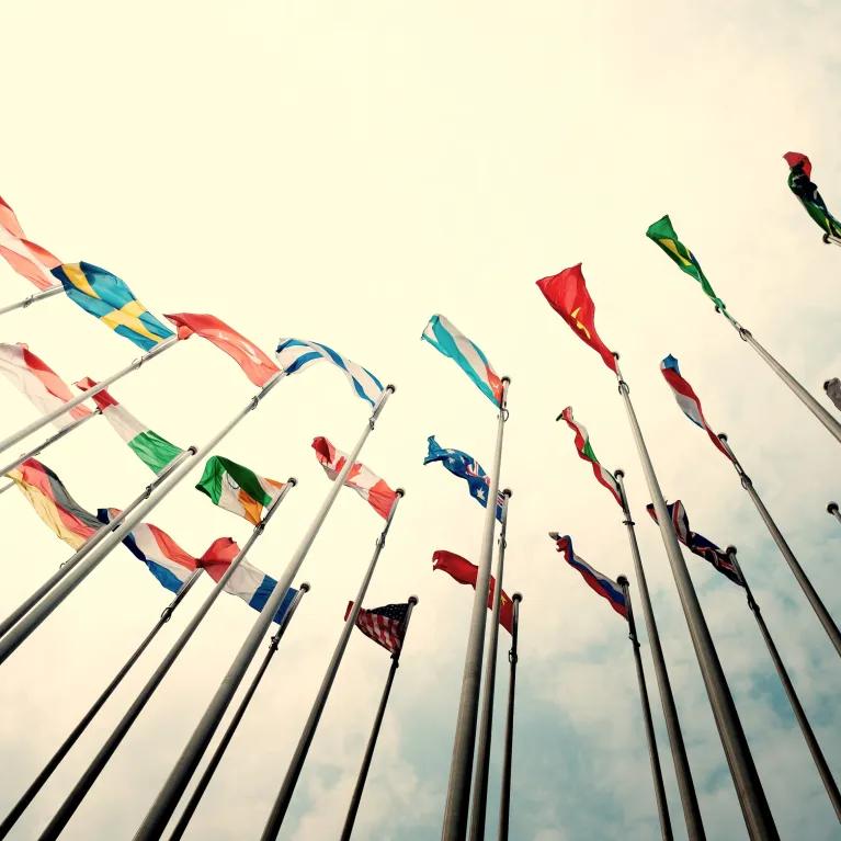 Looking up at flags of the world from below