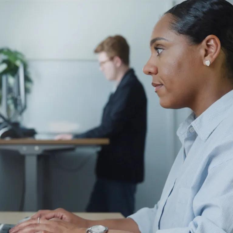 Support team typing at computers