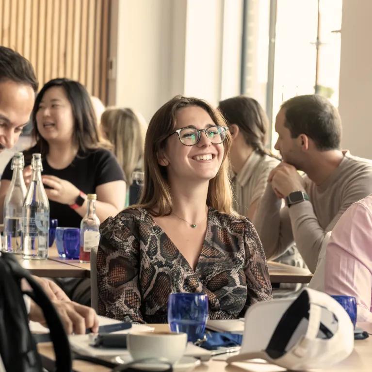 Groups of smiling students in an academic environment