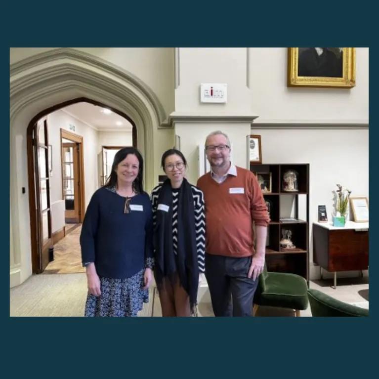 The coaching team stood together, smiling for a photograph