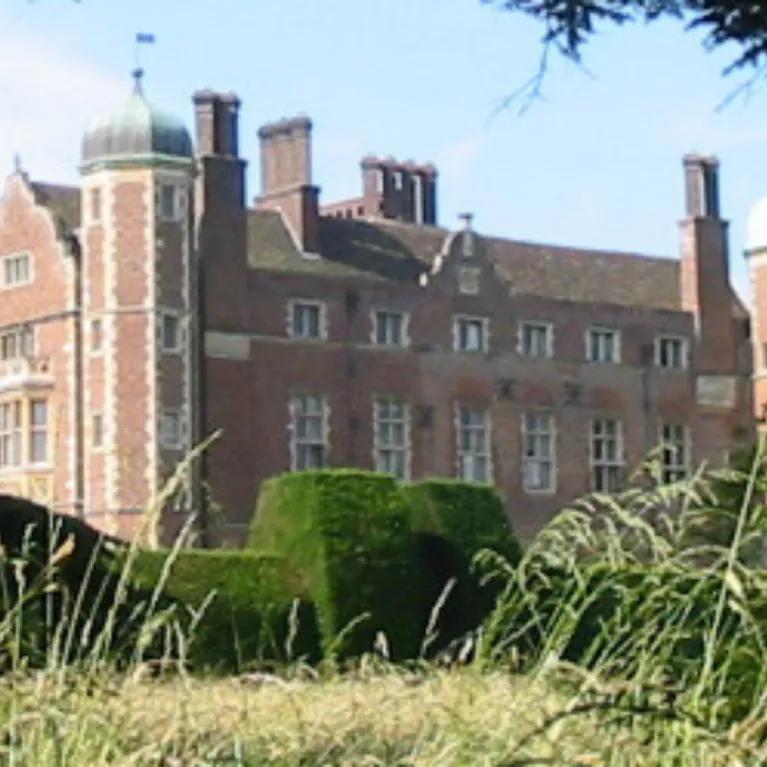 Photo of Madingley hall and its gardens. 