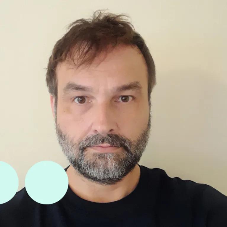 Head and shoulders photograph of man with beard