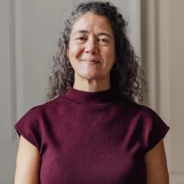 Women in red top looking to camera